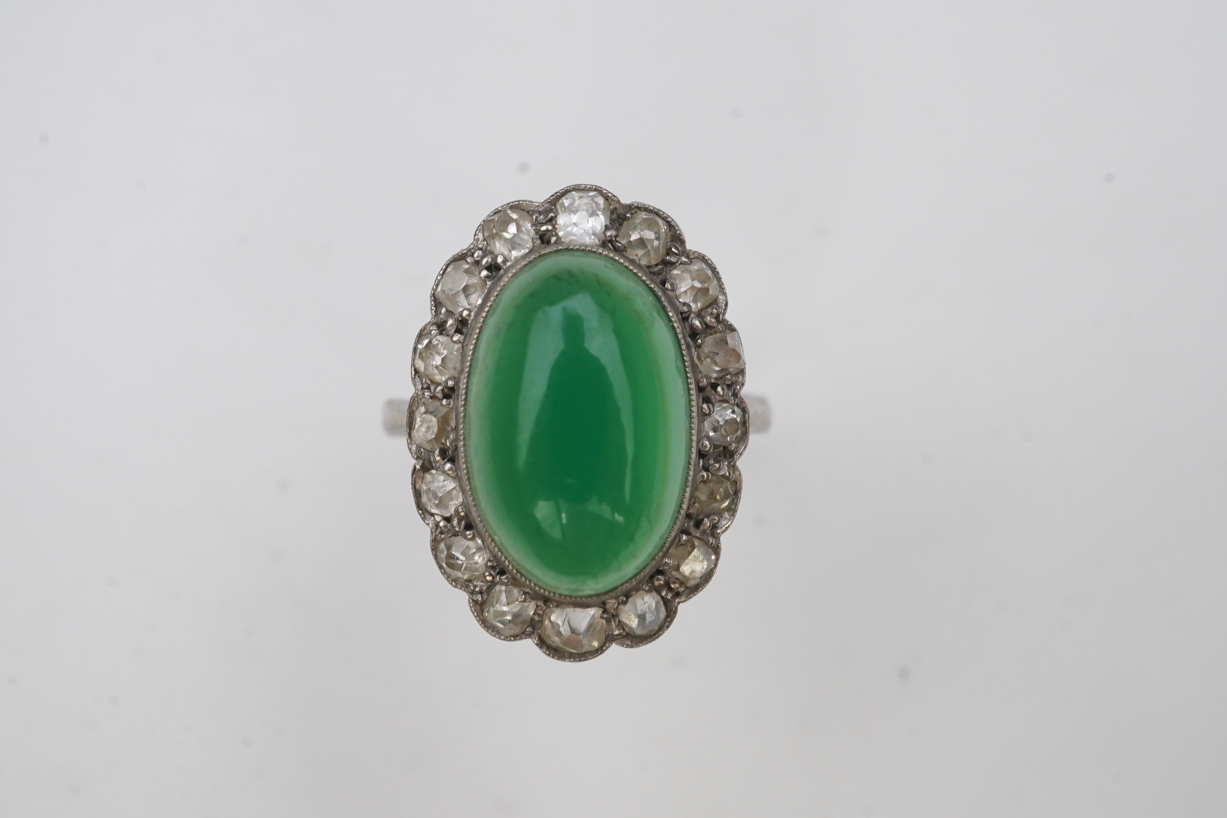 A green chalcedony and diamond ring, early 20th century